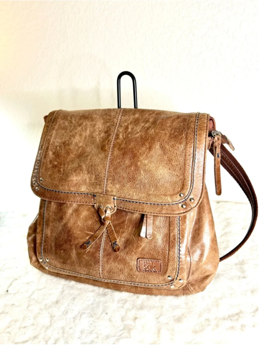 The Sak Ventura Leather Convertible Backpack in a brown, distressed leather